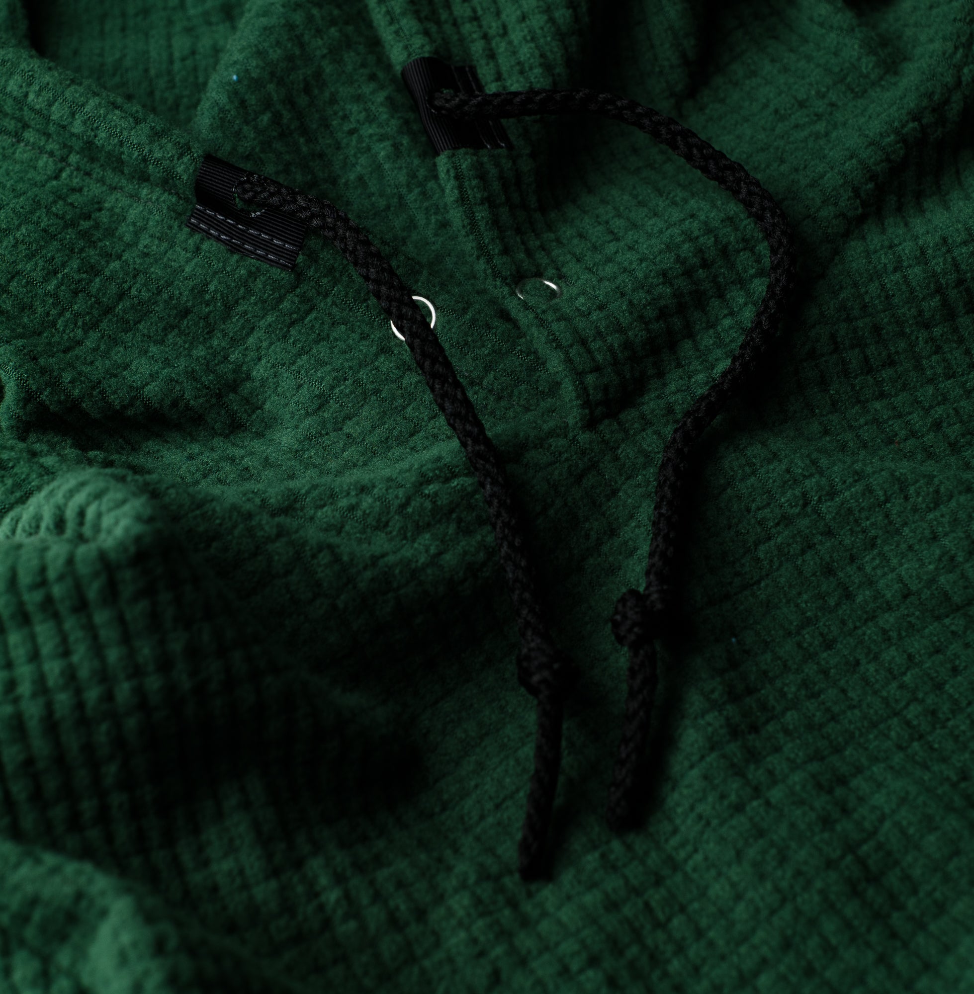 Closeup of the Highlander Hoodie in 'Green.'