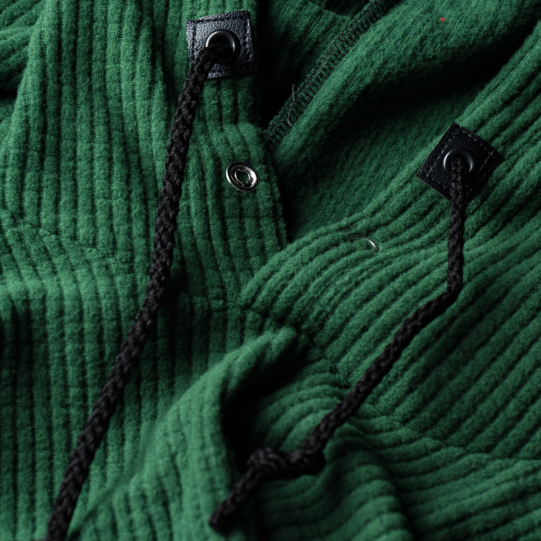 A closeup of a Green Highlander Hoodie.