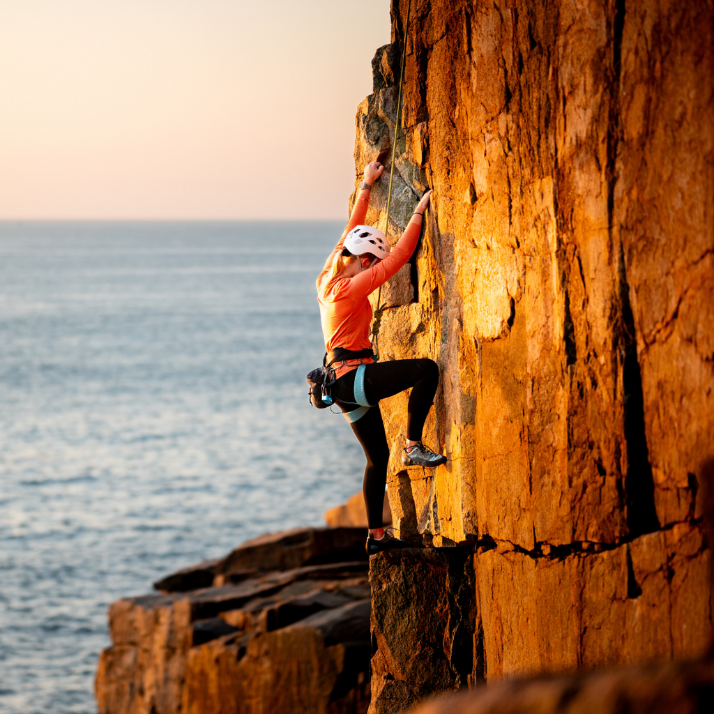 Climber wearing the Women's Flume Crewneck Baselayer.