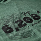 Closeup of the Mount Washington Elevation T-Shirt in Pine Green.